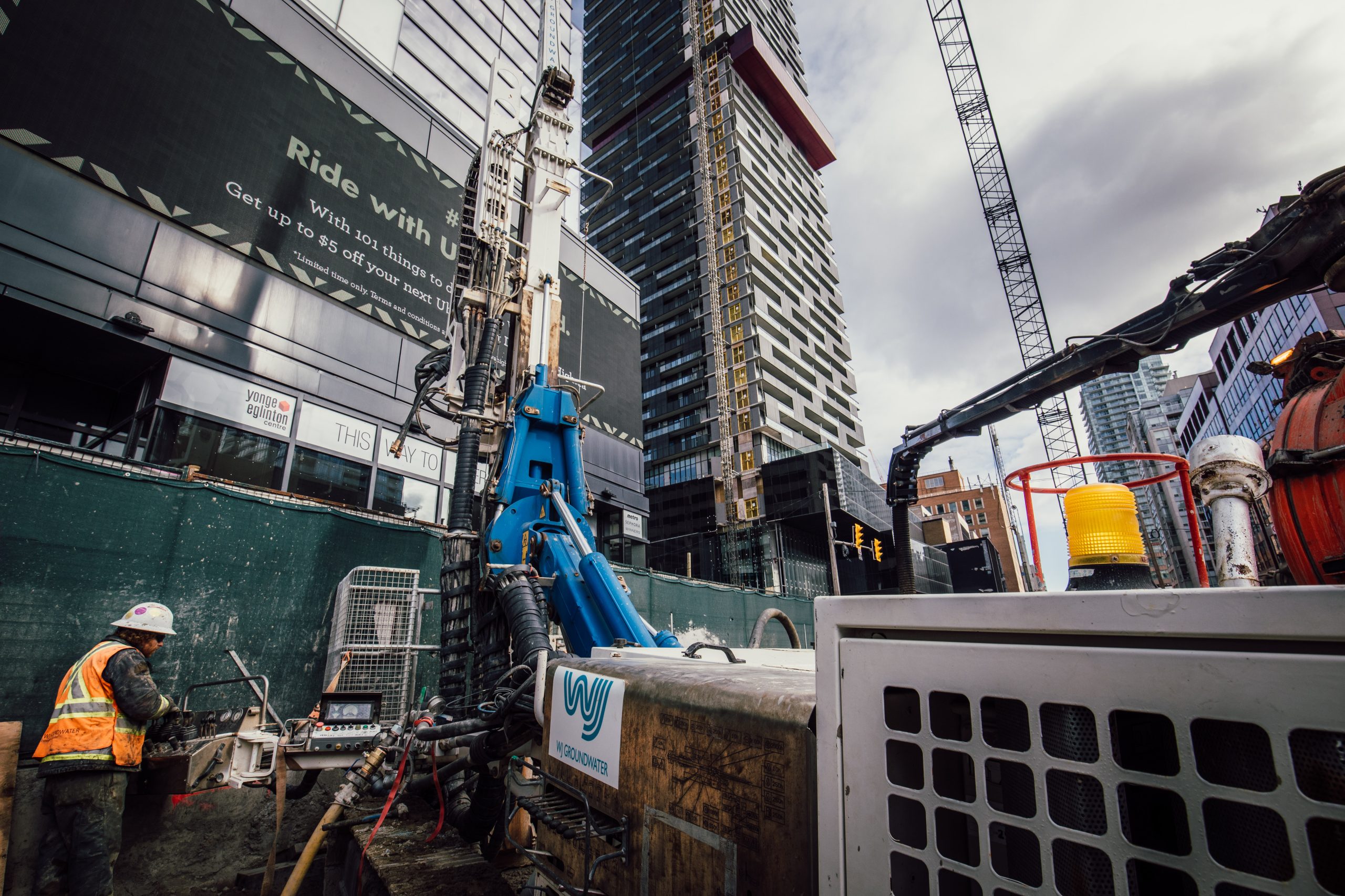 Drilling rig on street level with operator at Eglinton LRT